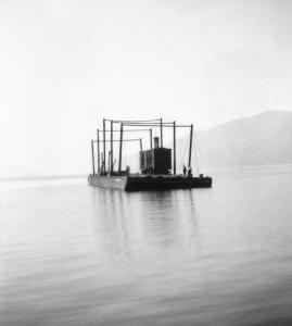 Boxcar on listing barge