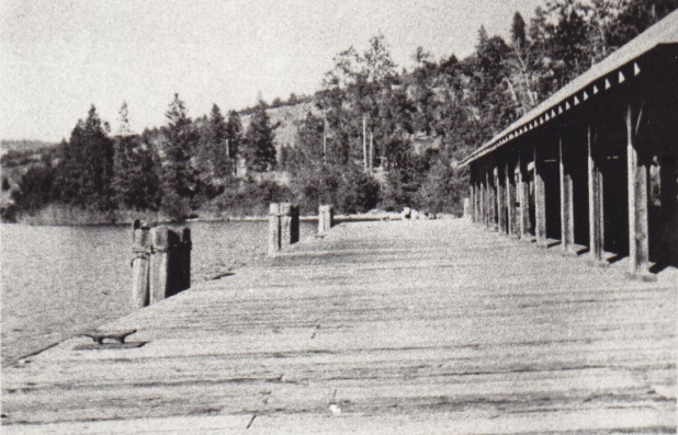 Figure 1: Warf at Okanagan Centre in early Days. Packing house to right.